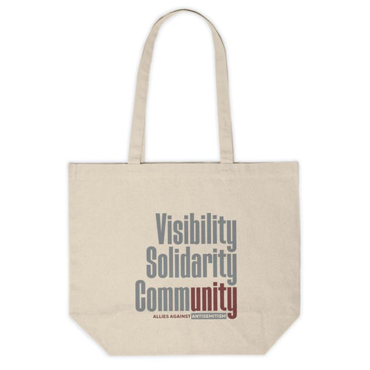 canvas tote bag with visibility solidarity community in orange, green, and burgundy block letters